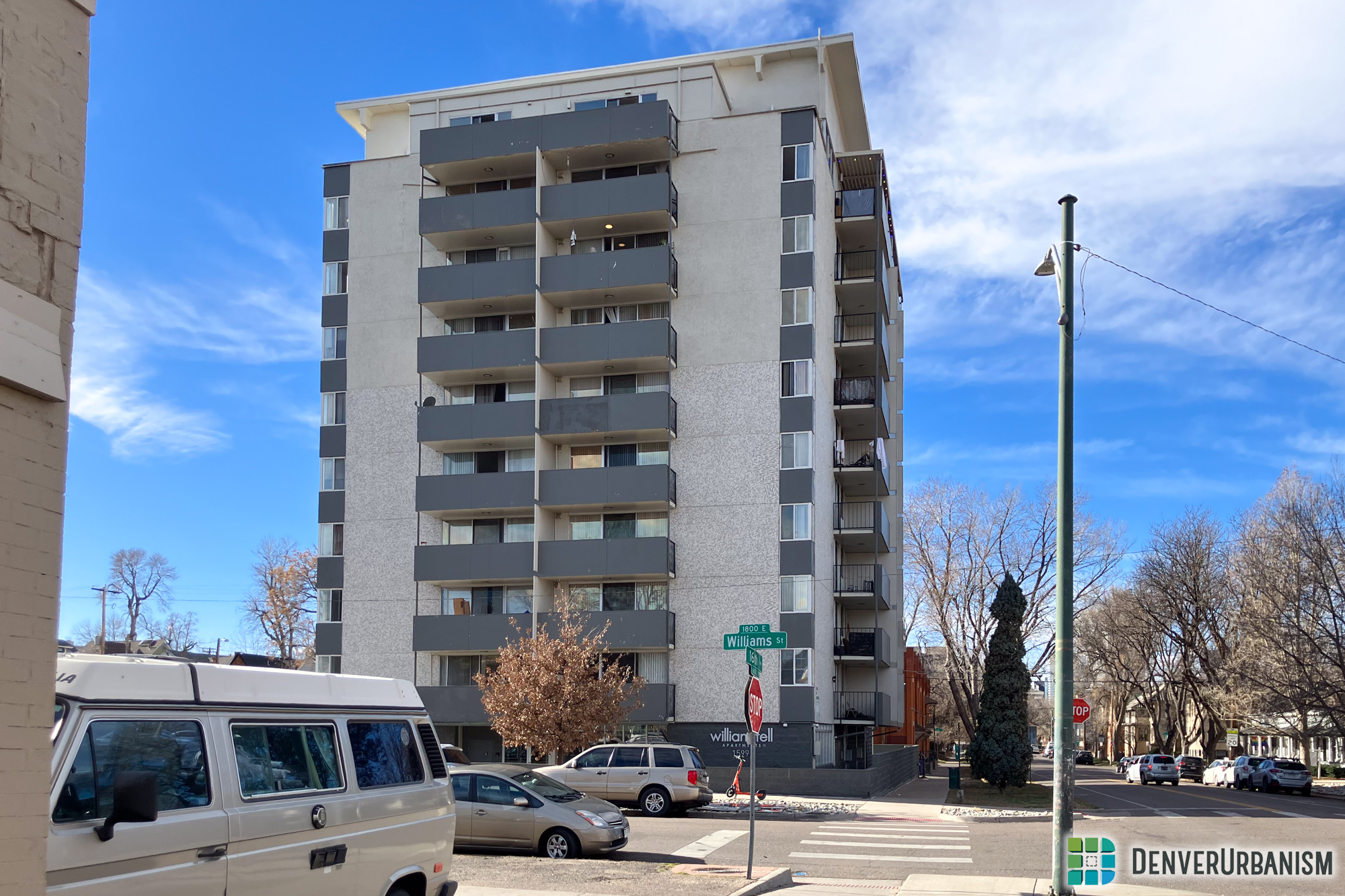 A 10-story building on a street corner in City Park West